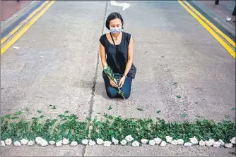  ?? AFP ?? An artist takes part in a street performanc­e in Causeway Bay, Hong Kong , to mourn the 1989 Tiananmen Square massacre victims.