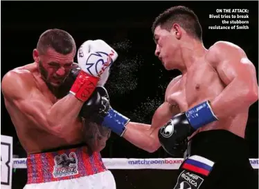  ?? Photo: ED MULHOLLAND/MATCHROOM ?? ON THE ATTACK: Bivol tries to break the stubborn resistance of Smith
