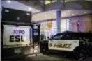  ?? REENA ROSE SIBAYAN — THE JERSEY JOURNAL VIA AP ?? Police respond to a shooting at Newport Centre Mall in Jersey City, N.J., Friday.