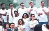  ?? ZOU HONG / CHINA DAILY ?? Students pose at the start of a philosophy summer school at Beijing Normal University on Monday.