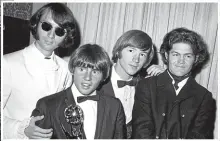  ?? AP ?? Peter Tork in 1967 and third from left, above, with The Monkees. The others are, from left, Mike Nesmith, Davy Jones and Micky Dolenz.