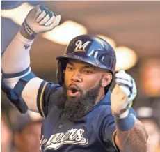  ?? JEFF HANISCH / USA TODAY SPORTS ?? Milwaukee Brewers first baseman Eric Thames celebrates after hitting a home run during the second inning against the Pittsburgh Pirates.