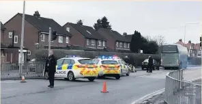  ?? Police at the scene after the accident and below, the air ambulance waiting on the field at Ormskirk Rugby Club ??