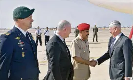  ?? AP ?? U.S. Defense Secretary Jim Mattis (right) shakes hands with Omani Brigadier Saleh bin Ahmed al-Hinai,head of the Oman Military Protocols and Public Relations, at Seeb Air Base, northwest of Muscat, Oman. Mattis said Russia, which intervened militarily...