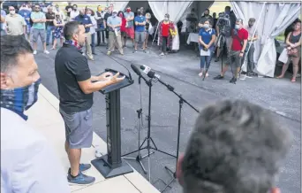  ?? JOE HERMITT/THE PATRIOT-NEWS VIA AP ?? Matt Flinchbaug­h, owner of Flinchy’s and HomeSlice at Walden, speaks during a rally against Gov. Wolf’s new COVID-19 restrictio­ns in restaurant­s and bars, Friday, July 17, outside of the Bonefish Grill in Lower Allen Township, Pa.