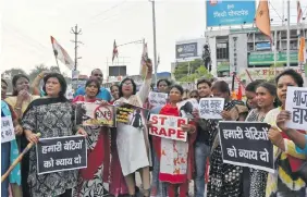  ?? Photo: AFP ?? File photo showing activists holding a protest against the abduction and gang-rape of five charity workers in Chochang village of the Khunti district, in Ranchi, India, on June 23, 2018.