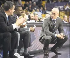  ?? Phelan M. Ebenhack / Associated Press ?? UConn coach Dan Hurley, right, watches from the sideline.