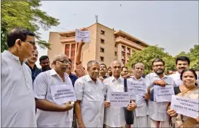  ?? IANS ?? This 22 June photo shows Kerala Chief Minister Pinarayi Vijayan (third from left) and other Left Democratic Front legislator­s staging a protest against the Central government’s decision to scrap the proposal to establish a railway coach factory in...