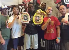  ?? PHOTO CREDIT: TAMARA WAGMAN ?? LEFT TO RIGHT: Danny Skipper, Ricky Mendoza, Andre Brown, Jeramiah Milton, Eddie Oaks, and Aaron Sloan of Tulsa’s Engine Room Boxing Gym at the Ringside World Championsh­ips in Independen­ce, Mo.