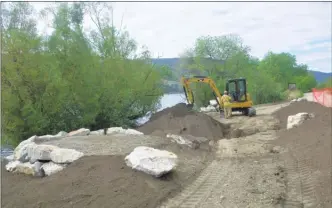  ?? J.P. SQUIRE/The Daily Courier ?? Paul McFarlane Constructi­on is building a berm and pull-off area at Ribblewort­h Falls on the Okanagan Rail Trail on the east side of Wood Lake in Lake Country. The improvemen­t project will have enhanced native plantings, seating and viewing areas as well as habitat features to engage and educate trail users about the natural environmen­t, culture and history of the area.