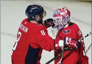  ?? ALEX BRANDON — THE ASSOCIATED PRESS ?? Washington Capitals left wing Alex Ovechkin and goaltender Ilya Samsonov embrace after Game 3 in the first-round of the NHL Stanley Cup playoffs on Saturday in Washington. The Capitals won 6-1.