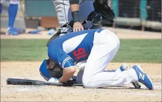  ?? Chris Carlson Associated Press ?? IT HURT when it happened, but the Dodgers said Andre Ethier was OK after being hit by a Carlos Rodon pitch Tuesday. He had to leave the game against the White Sox but X-rays were negative.