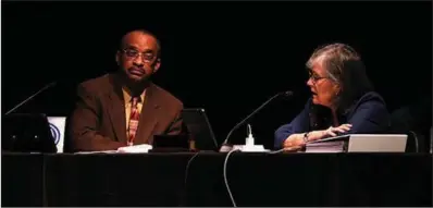  ?? (Arkansas Democrat-Gazette/Thomas Metthe) ?? Little Rock City Director Ken Richardson (left) voted present on an election for Mayor Frank Scott’s tax proposal during Tuesday’s meeting. Board member Kathy Webb, who successful­ly moved last month to table the measure, voted yes. “Most of the concerns my constituen­ts raised were addressed, and now I feel like it’s up to them to decide,” Webb said after the meeting.