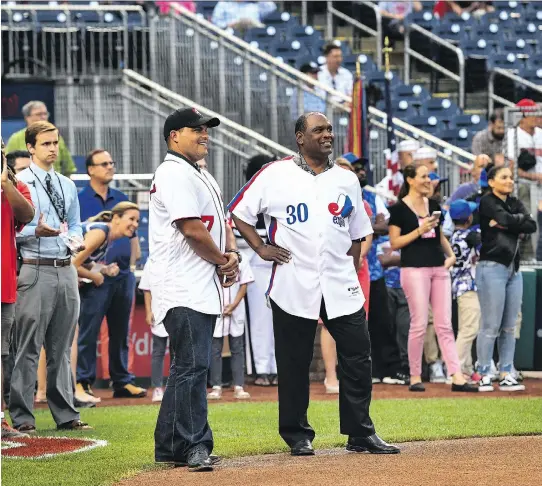  ?? TONI L. SANDYS/THE WASHINGTON POST ?? Ivan Rodriguez, left, and Tim Raines, were honoured by the Nationals on Monday night, but the history of the franchise complicate­s matters.