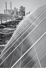  ?? [PHOTO BY CHRIS LANDSBERGE­R, THE OKLAHOMAN ARCHIVES] ?? A solar farm at the OG&amp;E Mustang power plant in west Oklahoma City includes more than 7,500 panels.