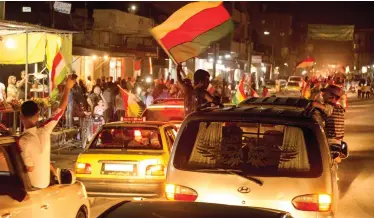  ??  ?? Syrian Kurds wave their party’s and Kurdistan flags as they tour by their cars celebratin­g after the Iraqi Kurds in Irbil held their independen­ce referendum, in Qamishli, north Syria in this Sept. 25, 2017 photo. (AP)