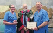  ?? PHOTO: LINDA ROBERTSON ?? Excellent teachers . . . Fracture clinic registered nurse Jill Cruice (left) and enrolled nurse Ross Beaton (right) with Dean of the Dunedin School of Medicine Prof Barry Taylor.