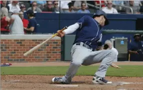  ?? PHOTO/JOHN BAZEMORE ?? San Diego Padres first baseman Wil Myers (4) falls back from a pitch as he bats in the sixth inning of a baseball game against the Atlanta Braves on Sunday in Atlanta. Atlanta won 9-2. AP