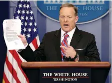  ??  ?? White House press secretary Sean Spicer holds a letter about former acting attorney general Sally Yates’s ability to testify to a Congressio­nal investigat­ion into Russian links with the Trump campaign. Photo: Reuters/Joshua Roberts