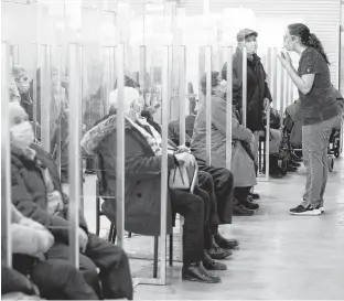  ?? REUTERS ?? Seniors sit in a waiting room after receiving their coronaviru­s disease vaccine in a clinic as Quebec begins vaccinatio­ns for seniors over 85 years old in Laval, Que., last Thursday.