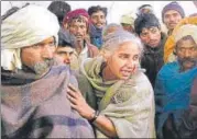  ?? PTI FILE ?? File photo of Narmada Bachao Andolan leader Medha Patkar with tribals during protests against raising the height of the Sardar Sarovar Dam without proper rehabilita­tion.