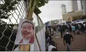  ?? ERANGA JAYAWARDEN­A — THE ASSOCIATED PRESS FILE ?? A vandalised portrait of Prime Minister Mahinda Rajapaksa is seen at an ongoing protest site outside President Gotabaya Rajapaksa's office in Colombo, Sri Lanka.