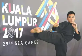  ??  ?? DINES DUMAAN of the Philippine­s after winning the gold medal in the men’s tanding putra class A 45-50 kg. division of the 29th Southeast Asian Games pencak silat competitio­n Tuesday at the Kuala Lumpur Convention Center.