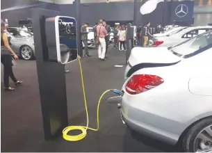  ?? PIYACHART MAIKAEW ?? An electric vehicle charging at a motor show. An excise tax waiver for full EVs is under considerat­ion.