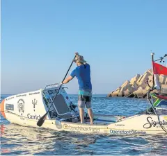  ??  ?? ADVENTURER: Chris Bertish off the coast of Morocco after starting his attempt to be the first person to cross the Atlantic Ocean on a stand-up paddleboar­d.