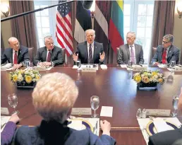  ?? REUTERS ?? US President Donald Trump, flanked by John J Sullivan, the Deputy Secretary of State, left, and Defence Secretary Jim Mattis, speaks at a working lunch at the White House on April 3.