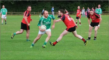  ??  ?? Donard-The Glen’s Laurence Daly makes a burst into Coolkenno territory during the JCFC clash.