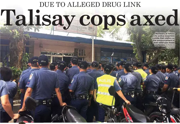  ?? CAMILLE PATERES ?? Members of Talisay City police assemble outside their station as the announceme­nt of their relief was madeyester­day.