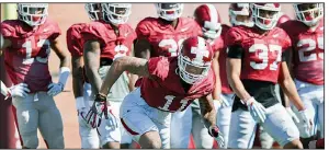  ?? NWA Democrat-Gazette/CHARLIE KAIJO ?? Razorbacks defensive back Ryan Pulley (center) runs drills during a March 3 practice at the University of Arkansas practice field in Fayettevil­le. Pulley has returned from last season’s torn pectoral muscle injury and is expected to lead the group of...