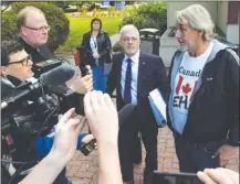  ?? JOE FRIES/Penticton Herald ?? Paul Braun and his lawyer, Paul Varga, speak to reporters Wednesday outside the Penticton courthouse.