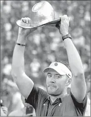  ?? AP/RON JENKINS ?? Oklahoma coach Lincoln Riley shows off the Golden Hat Trophy after the No. 12 Sooners beat the Texas Longhorns on Saturday at the Cotton Bowl in Dallas.