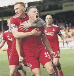  ?? ?? 2 Jota celebrates after scoring a late winner to secure a much-needed away victory for Celtic
3 Lewis Ferguson roars in delight after netting a secondhalf equaliser for Aberdeen