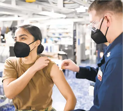  ?? U.S. NAVY PHOTO BY SEAMAN APPRENTICE CHRISTOPHE­R STACHYRA ?? Since the military receives federally allocated vaccines, it doesn’t report the doses administer­ed or distribute­d to the state, which skews the vaccinatio­n rates due to the large military presence in Hampton Roads.