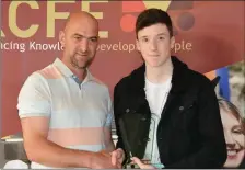  ??  ?? Cathal O’Connor pictured presenting MIchael O’Shea with his Building, Constructi­on and Joinery award at the KCFE awards on Thursday night.