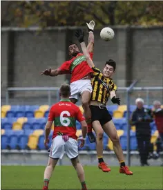  ??  ?? Rathnew’s Josh Graham and Enniskerry’s Stephen Cahill compete for a high ball at Joule Park, Aughrim. s