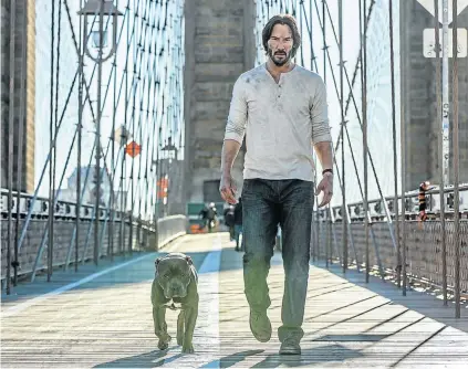  ??  ?? TERRIER ALERT: Keanu Reeves as John Wick, and sidekick