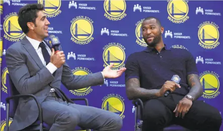  ?? Ben Margot / Associated Press ?? Warriors general manager Bob Myers (left) helps introduce his new center, DeMarcus Cousins, to the media Thursday.