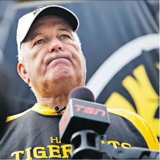  ?? AARON LYNETT/THE CANADIAN PRESS ?? Hamilton Tiger-Cats head coach June Jones speaks to reporters after a practice in Hamilton on Tuesday. Jones called the team’s hiring and firing of Art Briles “an emotional thing.”