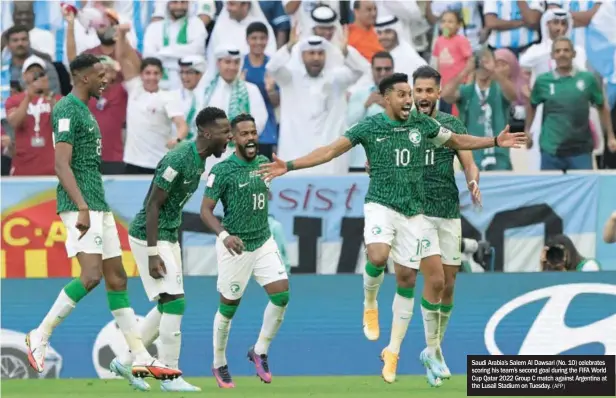  ?? (AFP) ?? Saudi Arabia’s Salem Al Dawsari (No. 10) celebrates scoring his team’s second goal during the FIFA World Cup Qatar 2022 Group C match against Argentina at the Lusail Stadium on Tuesday.