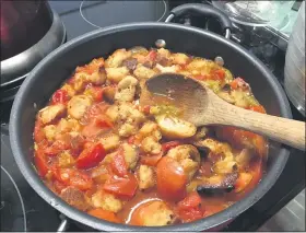  ?? JANET PODOLAK FOR THE NEWS-HERALD ?? To make a delicious tomato gratin, pieces of baguette torn into ¾-inch pieces, are first browned then submerged as they are cooked with ripe tomatoes, also cut into ¾-inch pieces.