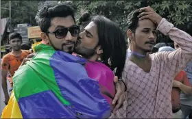  ?? AP/RAJANISH KAKADE ?? Gay rights activists celebrate Friday in Mumbai, India, after the country’s top court struck down a colonial-era law that made homosexual acts punishable by up to 10 years in prison.