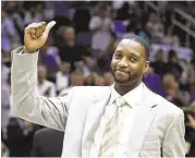  ?? John Raoux / Associated Press ?? Now an NBA analyst for ESPN’s “The Jump,” Tracy McGrady says he had to adjust his game when a trade to the Rockets made him Yao Ming’s teammate.