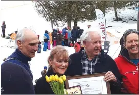  ?? PAUL ETHIER ?? Flowers and a plaque in appreciati­on for Fred and Lillian Korman’s generosity and heart. Fred Cuplinskas, winter program director for the Adaptive Sports Foundation with Owl’s Head’s Lillian and Fred Korman and ASF’S longtime volunteer Lucy Davis.