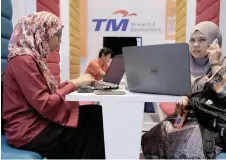  ?? Photo — Bernama ?? Analysts are wary about TM’s prospects and ability to retain its revenue growth, despite the group’s cost rationalis­ation programme.