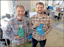  ?? Cliff Grassmick / Staff Photograph­er ?? Trent Lewis, left, and his brother Coulter have produced a non toxic lawn care product that's marketed directly to consumers.