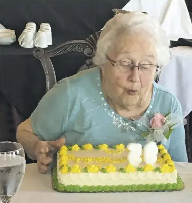  ?? COURTESY PHOTOS ?? Lois Snead blows out the candles on her 95th birthday cake.